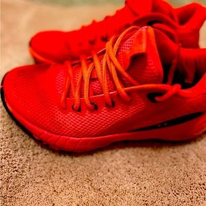 Under Armour size 6 youth tennis shoes orangey red color